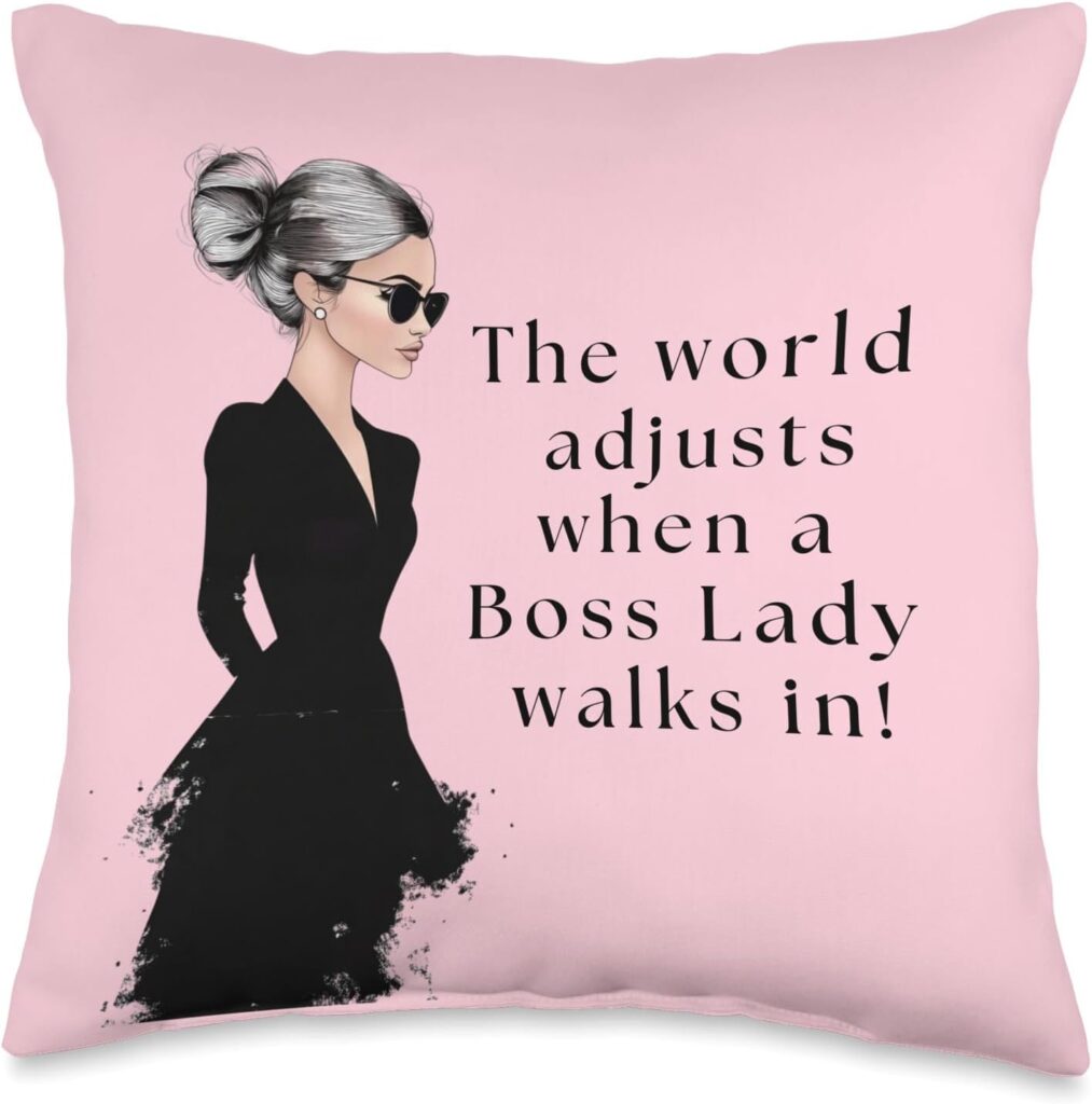 Chic pink pillow with a confident boss lady illustration and empowering quote: "The world adjusts when a Boss Lady walks in!